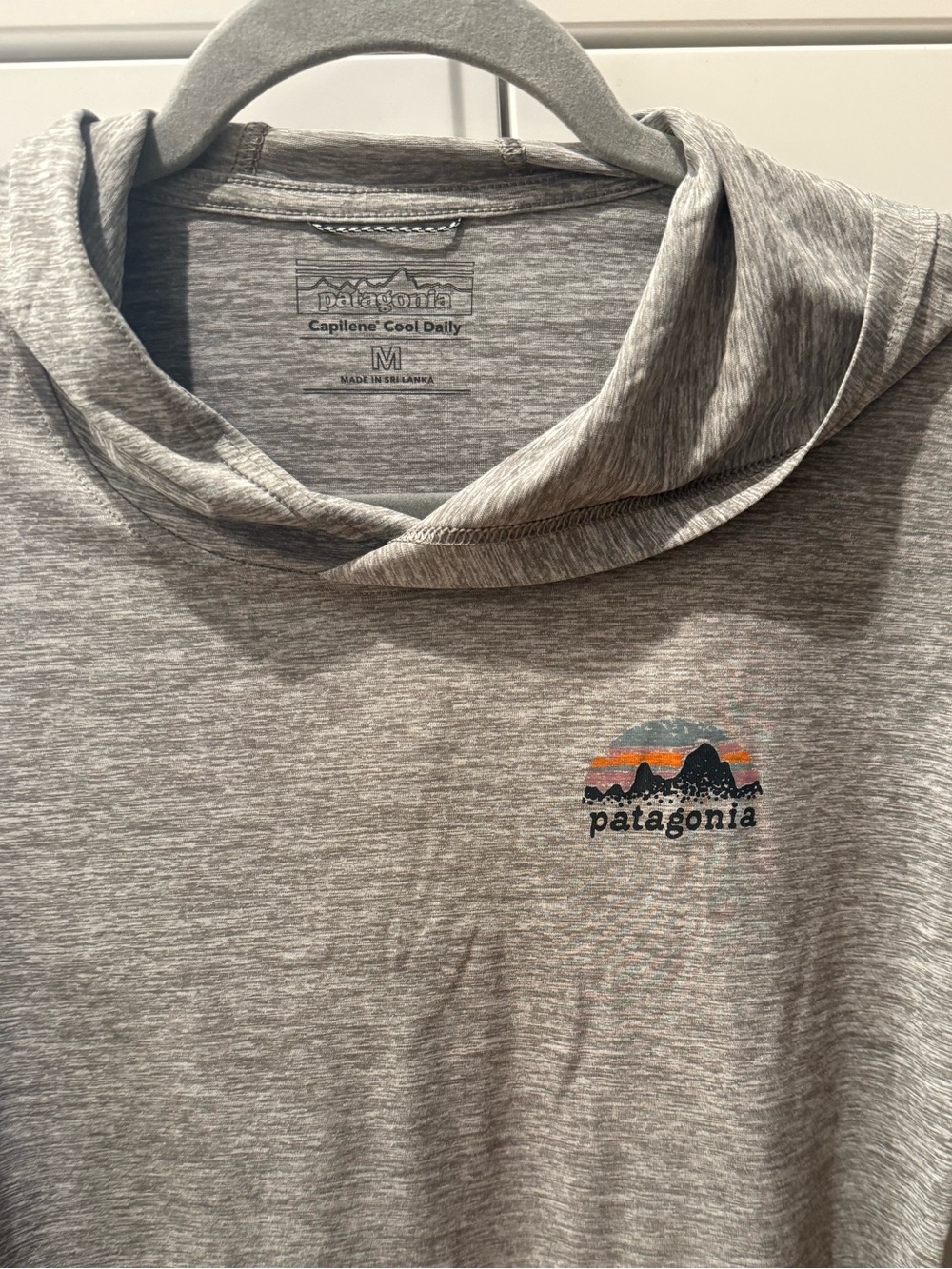 Patagonia Capilene long sleeve hooded shirt , like new , size M